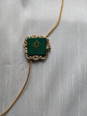 Bottle green kasuti rakhi with hand embroidery detail
